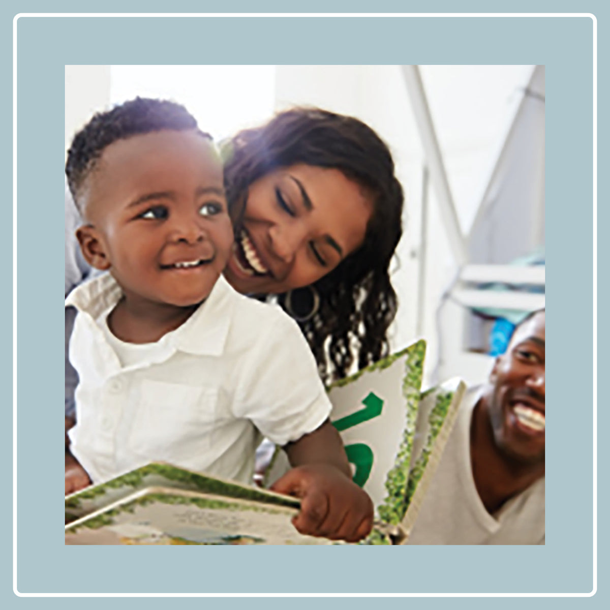 parents reading with young son
